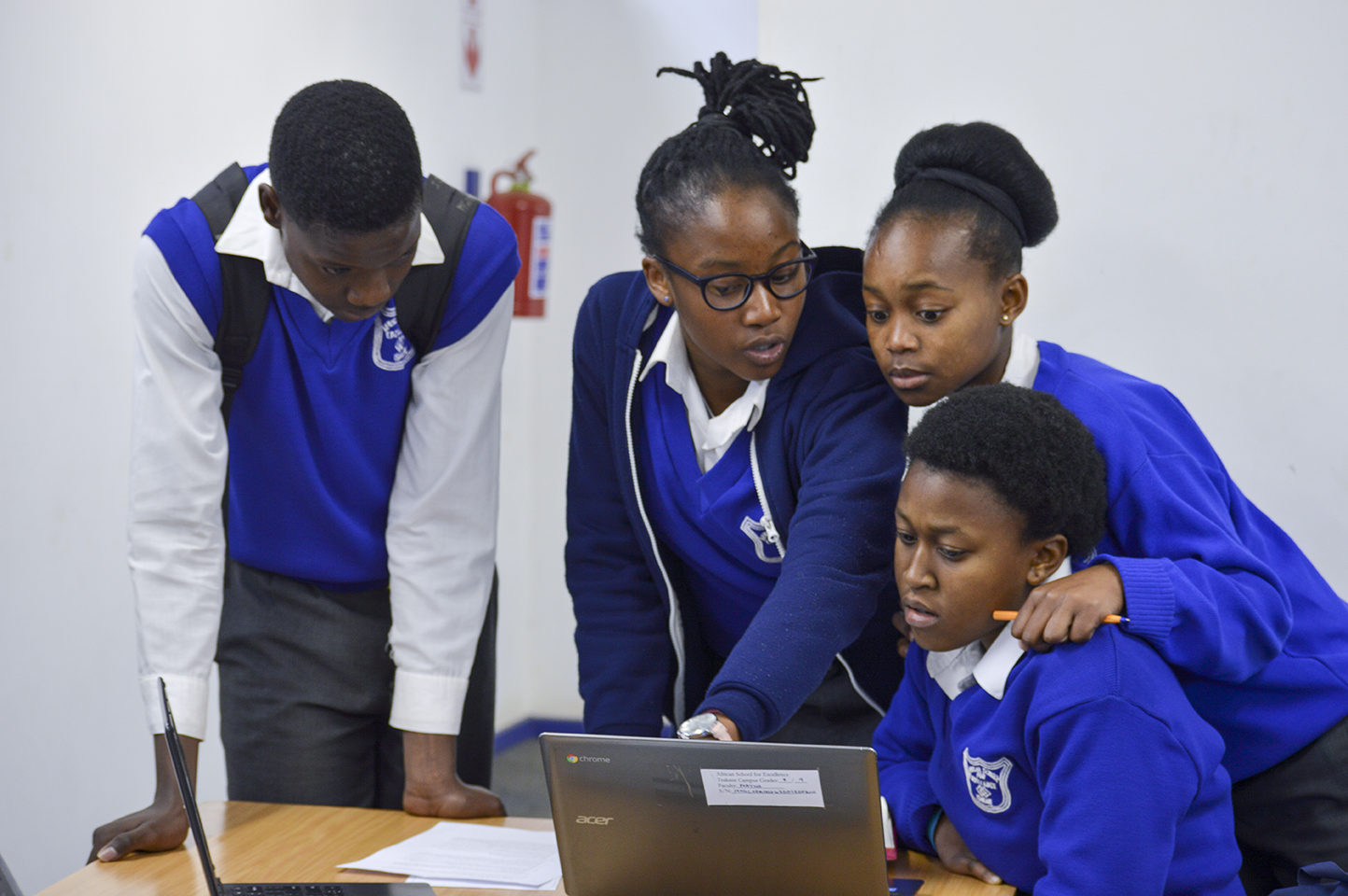 School learners at their desks in a classroom